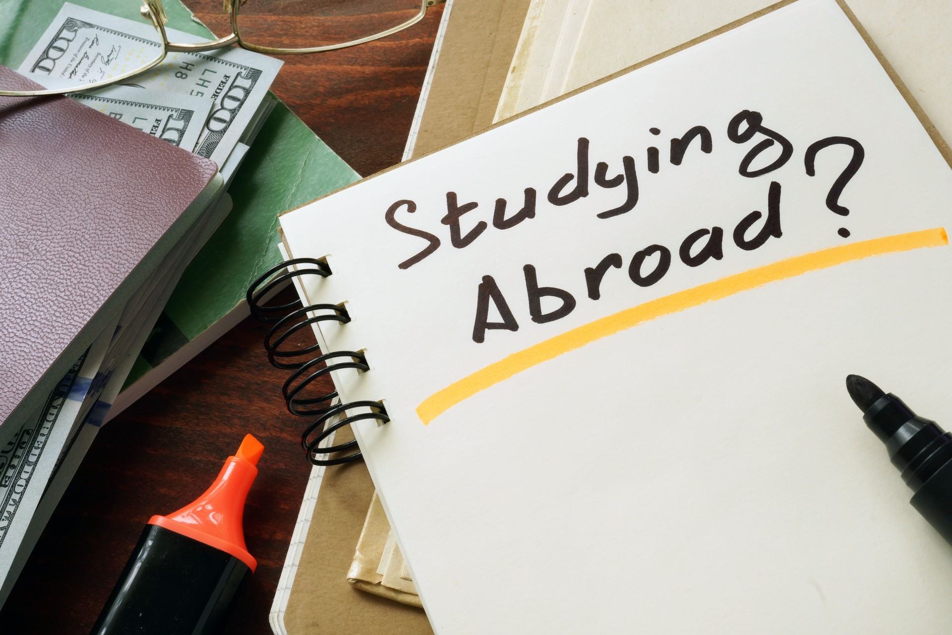 Studying Abroad  concept. Notepad on the table.
